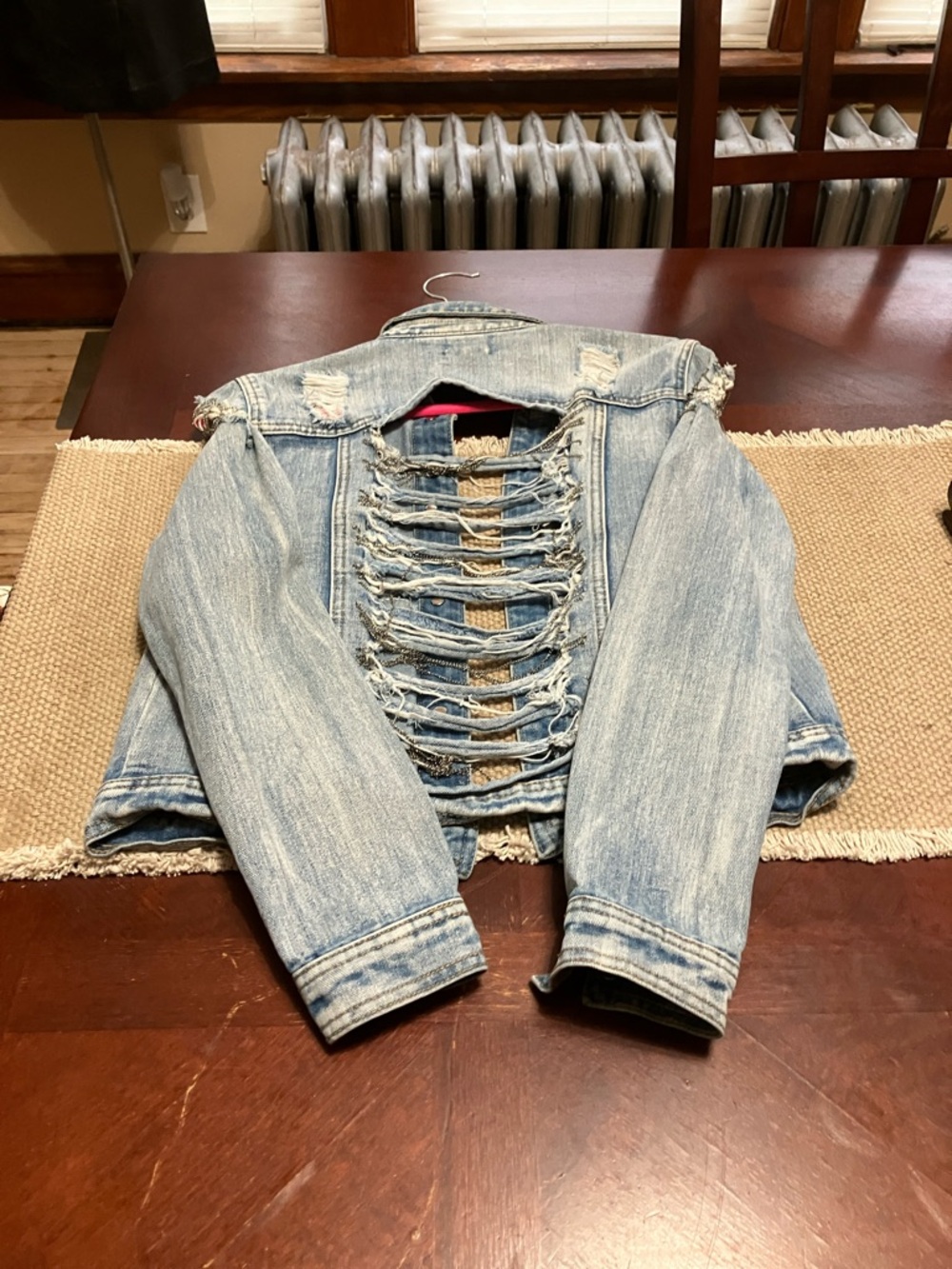 Distressed Light Blue Denim Jacket with Ladder Back Detail